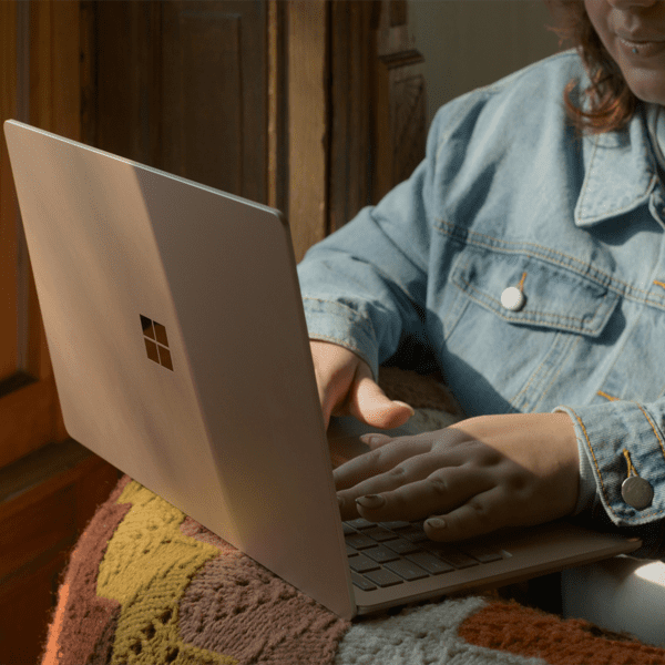 Writing a letter at a laptop